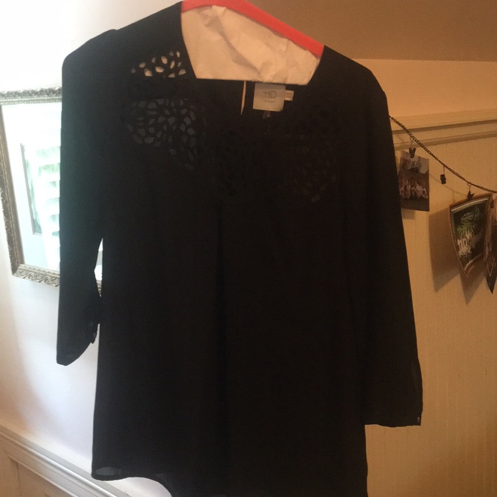 A black cutout print long sleeve top